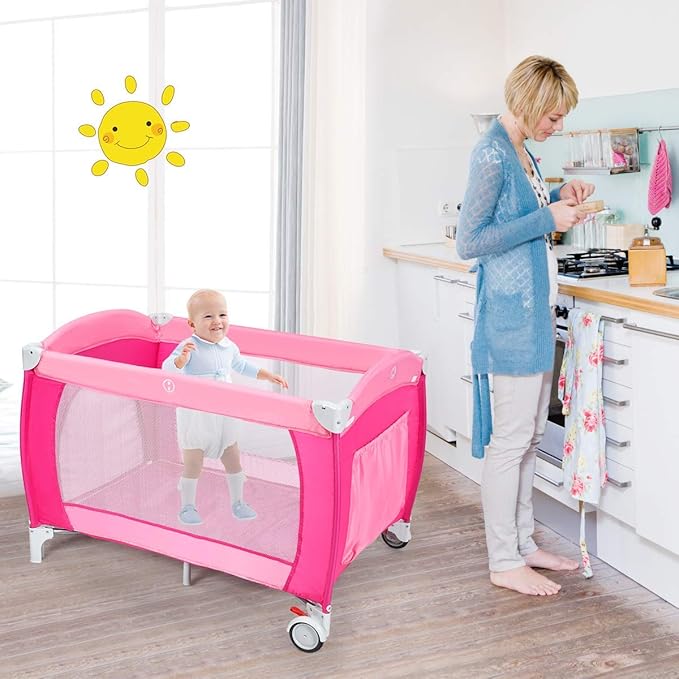 Costzon 4 in 1 Pink Pack and Play with Bassinet, Portable Baby Playard with Adjustable Canopy, Side Zipper Entrance, Music Box, Wheels/Brake, Foldable Infant Pink Bassinet for Baby Girl Toddlers
